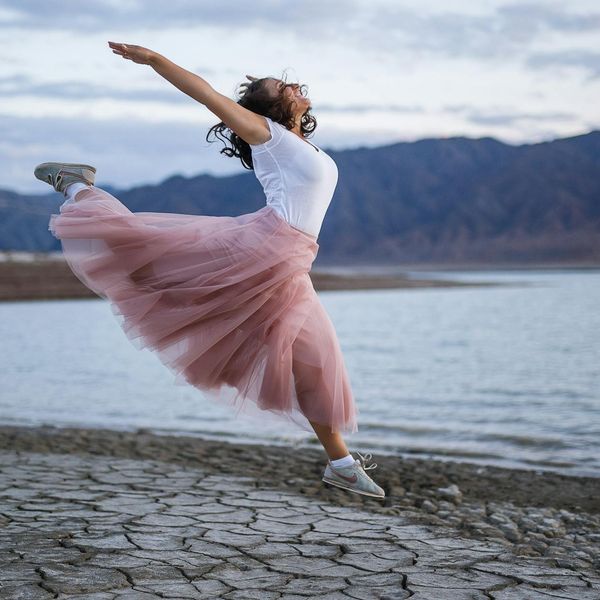 Woman feeling energetic and happy outdoors.